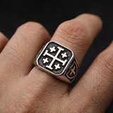 Man wearing the Jerusalem Cross stainless steel signet ring on his finger, with a crusader shield engraved on the side
