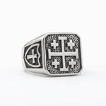 Jerusalem cross silver signet ring on white studio background