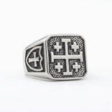 Jerusalem cross silver signet ring on white studio background