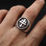 Man wearing the Cross of Lorraine stainless steel signet ring on his finger, showing the bold Christian cross design