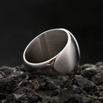 Inside view of the men’s stainless steel signet ring, showing the smooth polished band and interior finish
