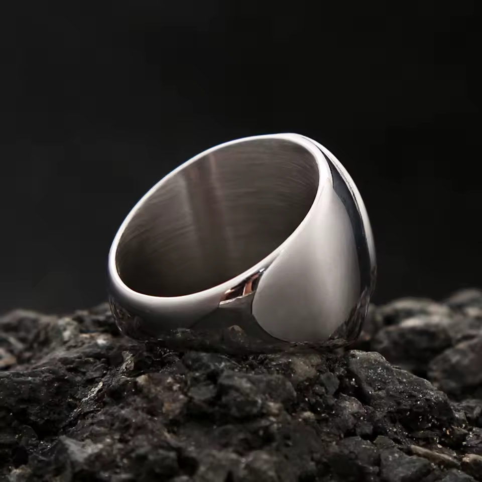 Inside view of the men’s stainless steel signet ring, showing the smooth polished band and interior finish