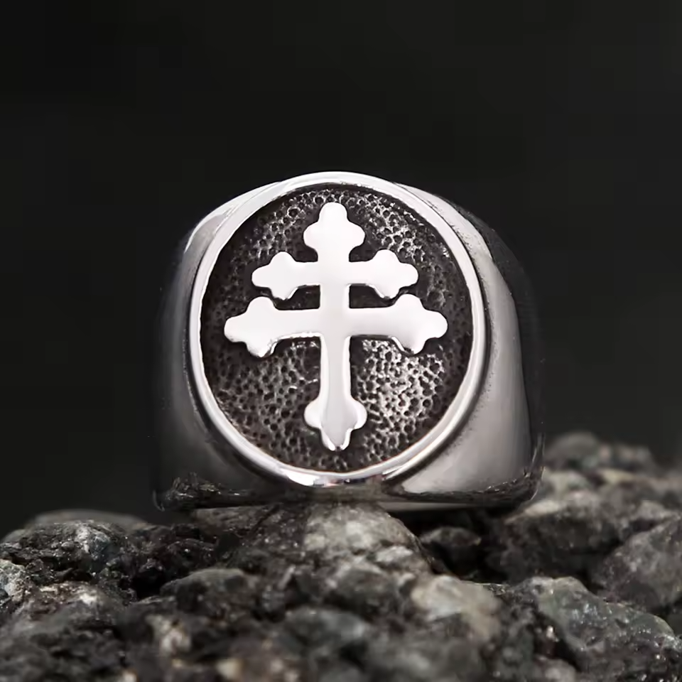 Front view of the Cross of Lorraine men’s ring, with a polished silver cross on a dark textured background