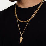 Man wearing 18K gold plated angel wing necklace layered with gold cuban chain, black t-shirt