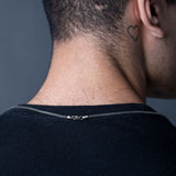 Back view of sterling silver Franco chain clasp on man's neck