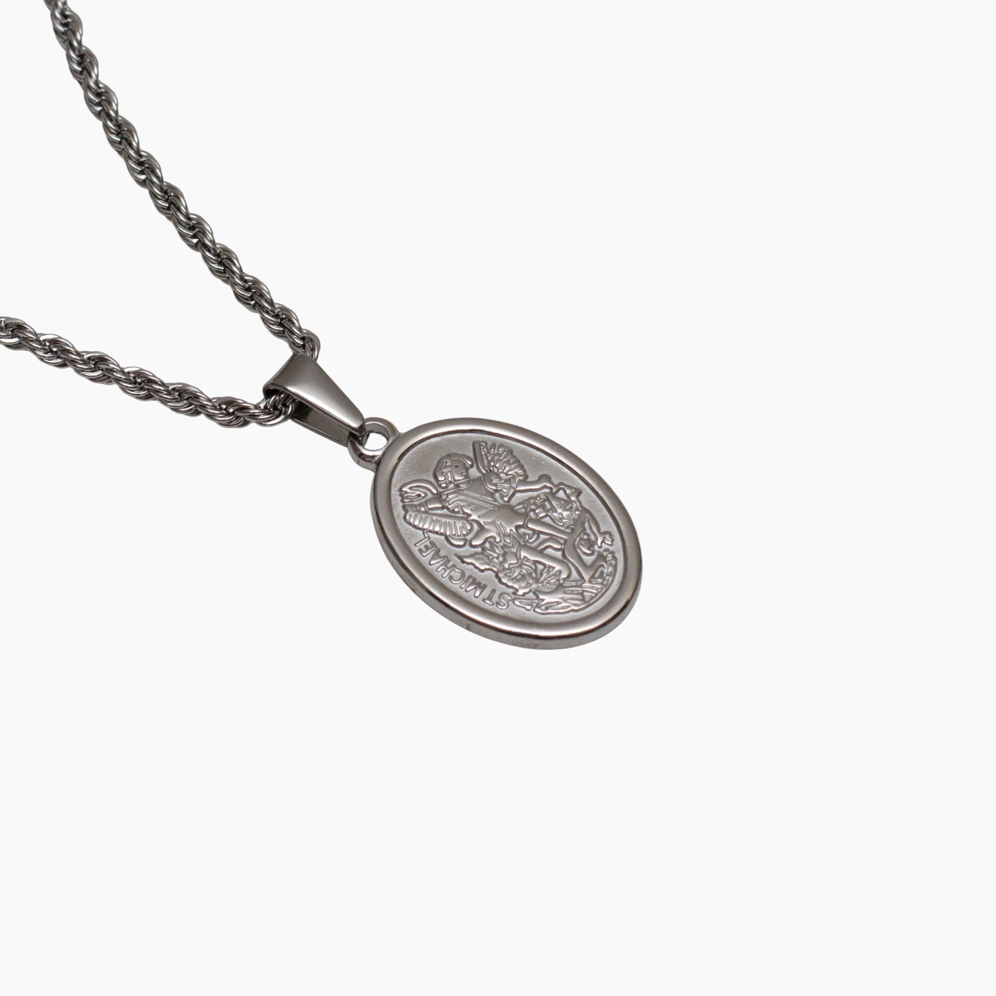 Silver St. Michael necklace with a detailed pendant on a white background