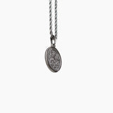Silver St. Michael necklace with a pendant on a white background