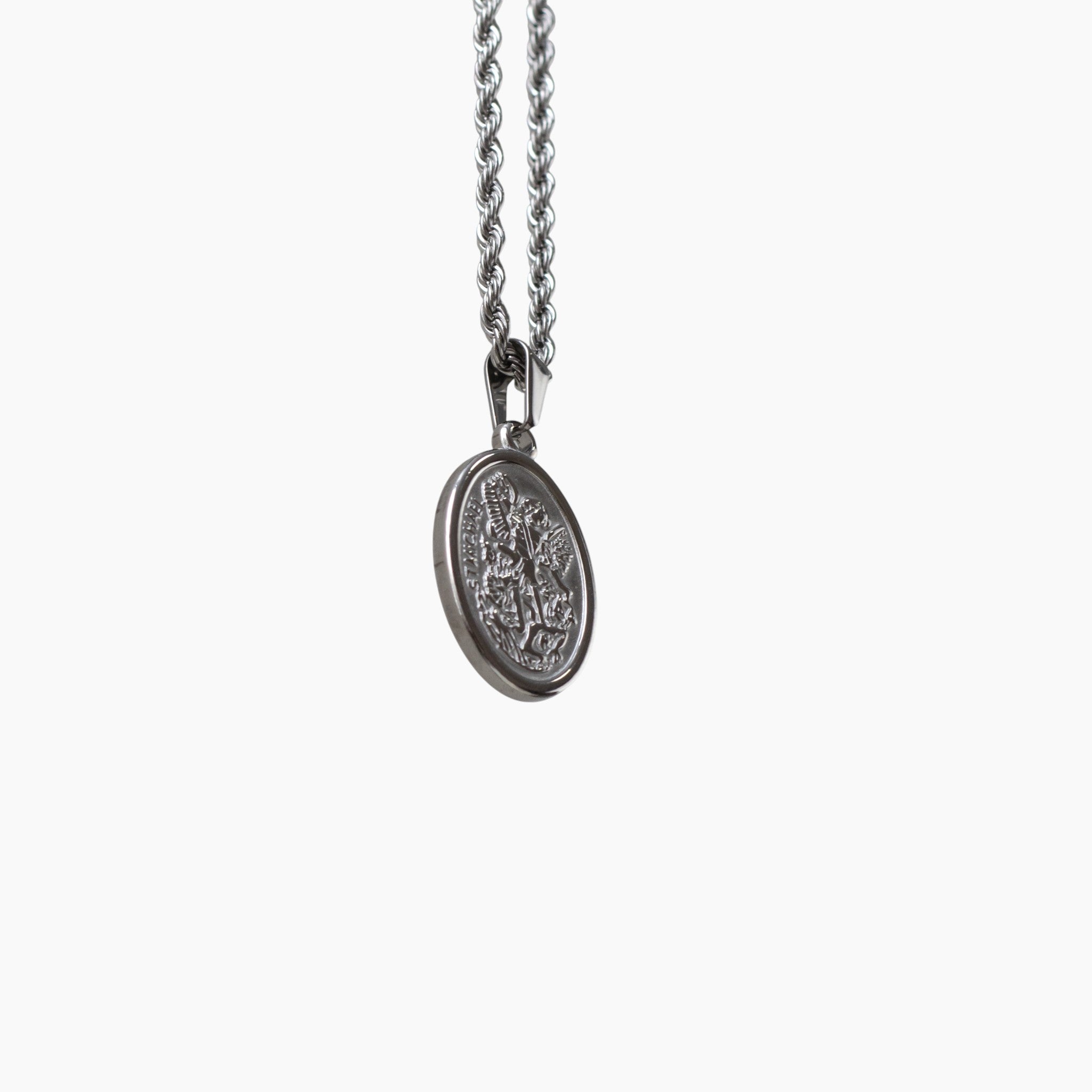 Silver St. Michael necklace with a pendant on a white background
