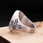 Side view of the men’s stainless steel Sacred Heart ring, showing the engraved cross on the band and brushed finish