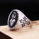 Angled view of the Sacred Heart of Jesus signet ring for men, showing the oval face and engraved side cross