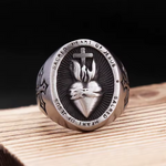 Sacred Heart of Jesus men’s ring in stainless steel, front view showing the flaming heart, cross and engraved inscription