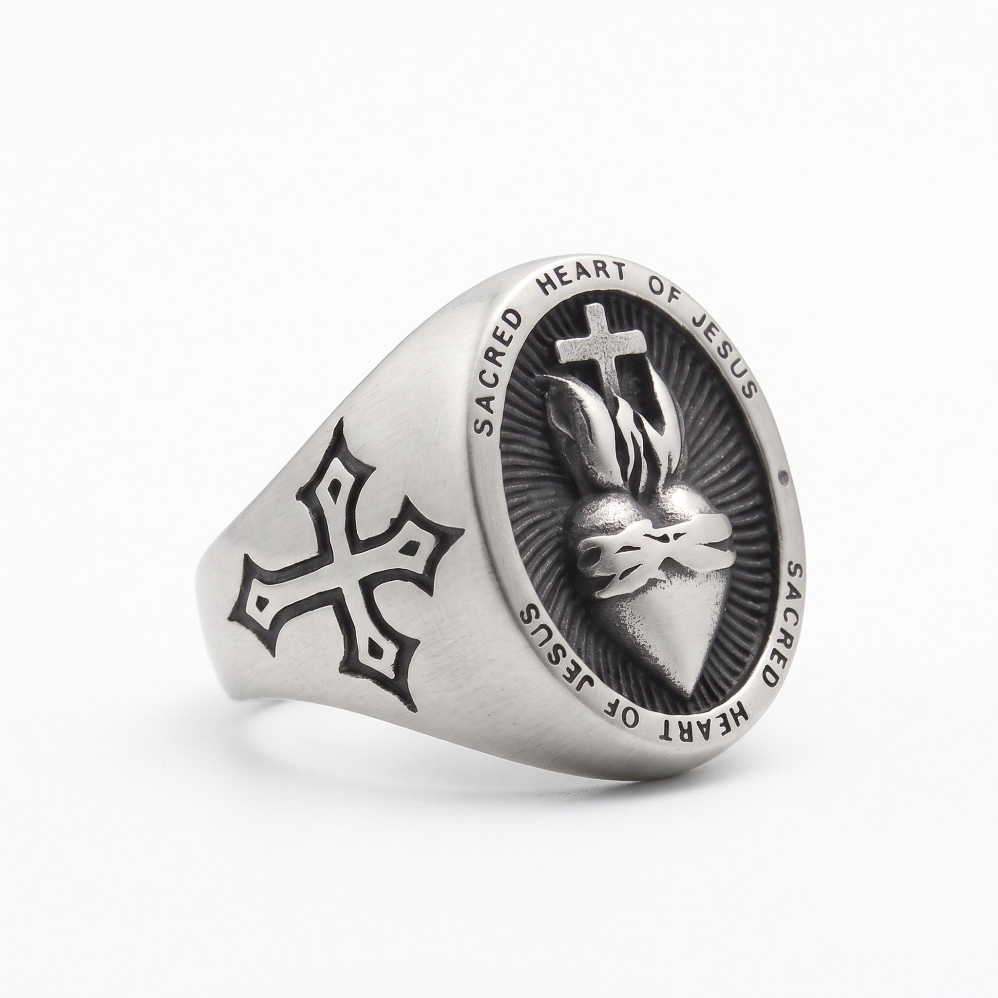 Catholic Sacred Heart men’s ring in brushed stainless steel, angled view of the heart design and cross on the band