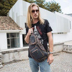 Man wearing a Unique brown vintage leather cross body bag