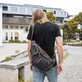 Man wearing a Unique brown vintage leather cross body bag